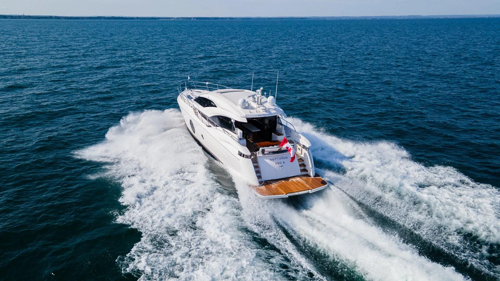 A sleek yacht cruises swiftly through the open water, showcasing its elegant design and powerful performance. aboard NEPTUNUS 650E Yacht for Sale