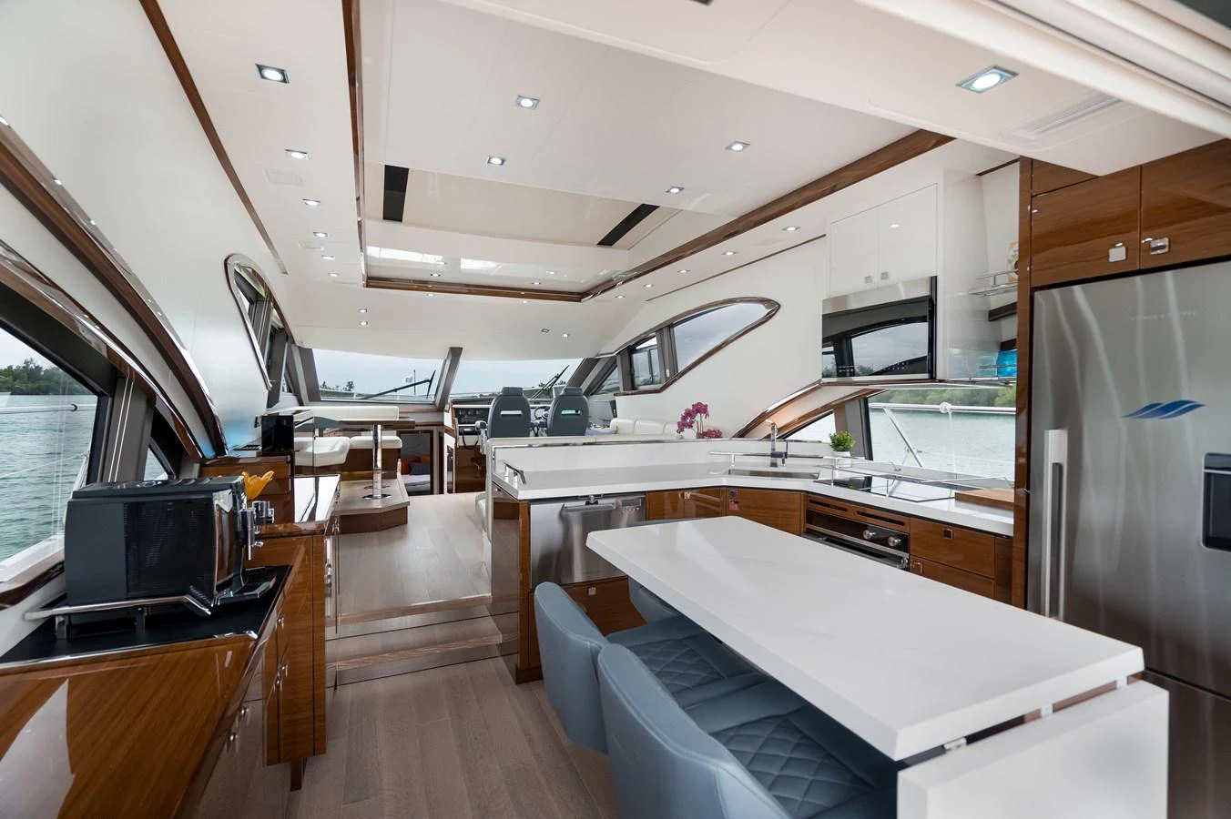 The yacht's salon features a modern and spacious design with ample seating and high-end finishes. aboard NEPTUNUS 650E Yacht for Sale