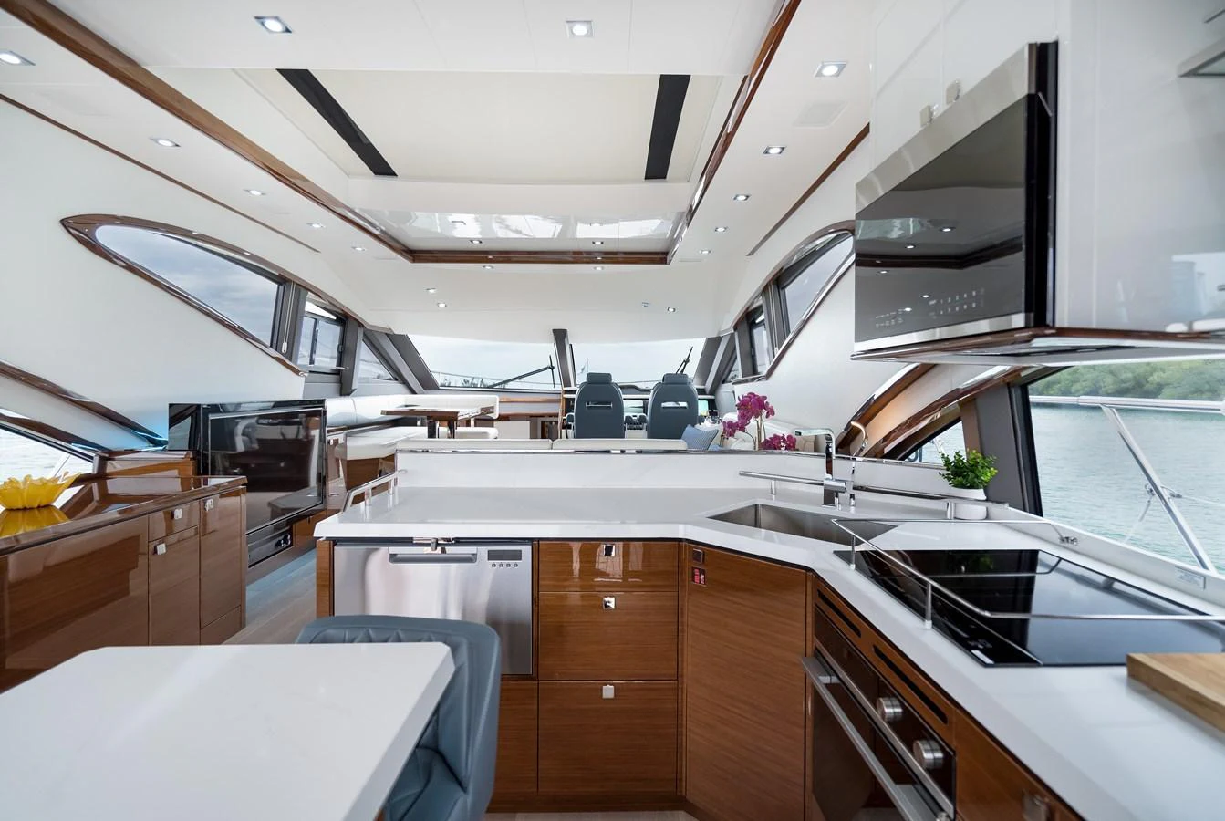 The yacht's galley is modern and spacious, featuring sleek appliances and ample counter space. aboard NEPTUNUS 650E Yacht for Sale