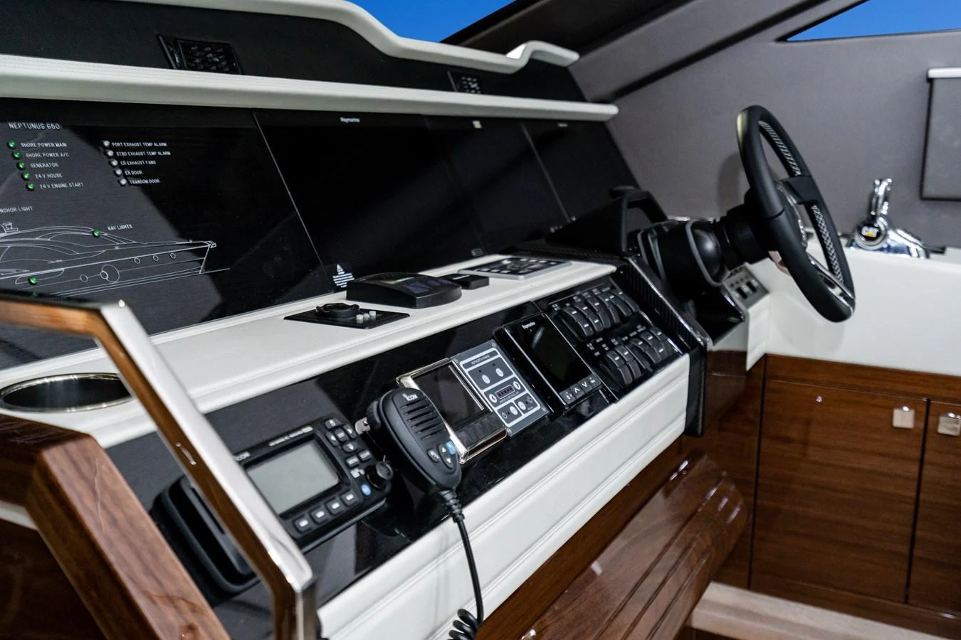 The helm station features advanced navigation and control systems with a sleek, modern design. aboard NEPTUNUS 650E Yacht for Sale