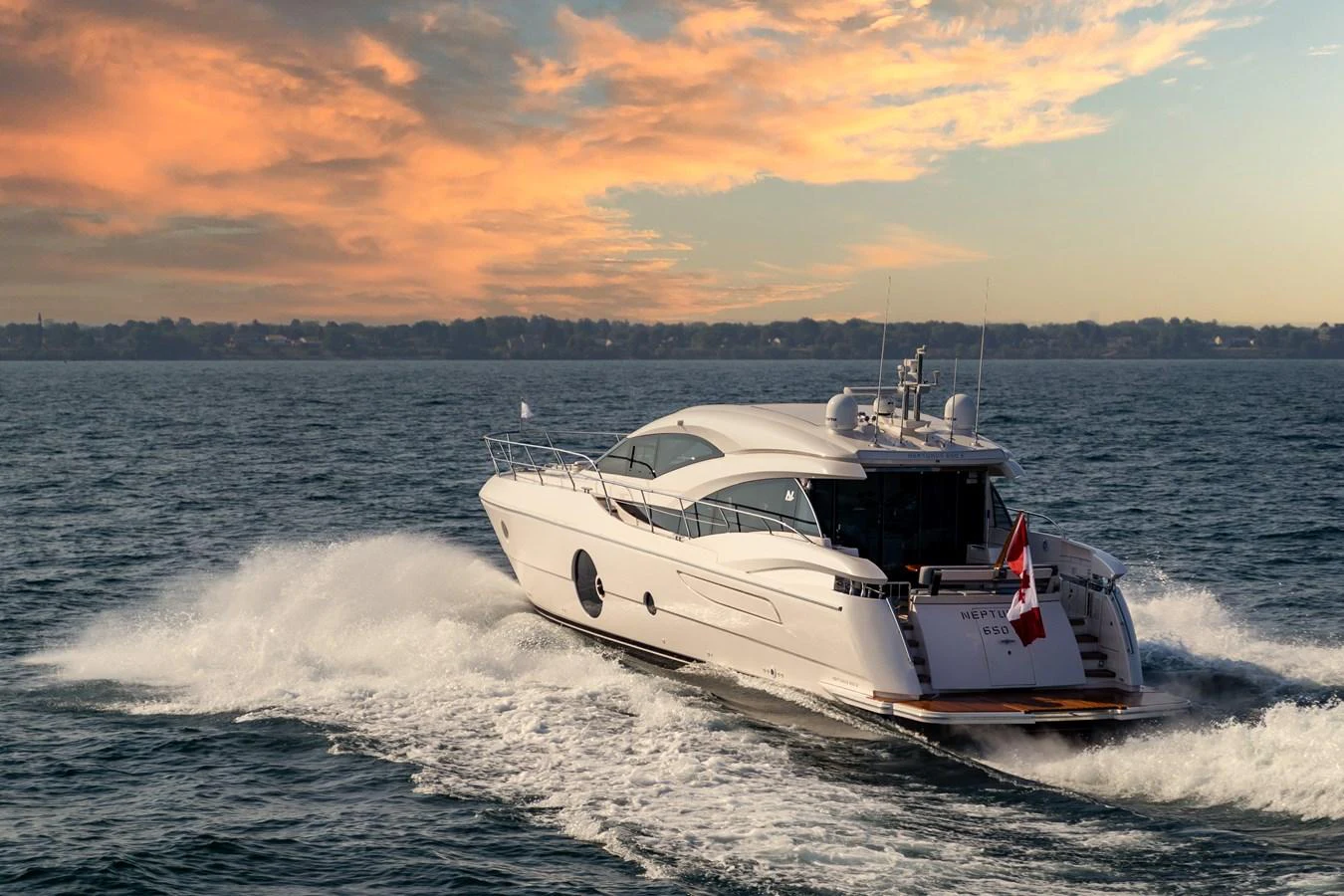 A sleek yacht cruises through open waters at sunset, showcasing its elegant design and powerful performance. aboard NEPTUNUS 650E Yacht for Sale