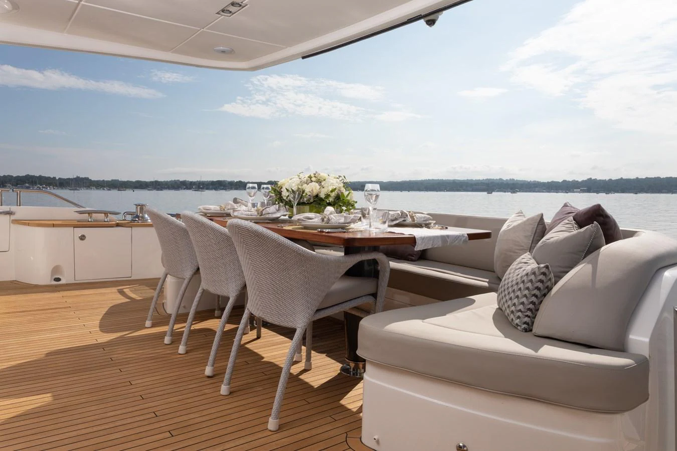 a table and chairs on a deck aboard JUST PERFECT Yacht for Sale
