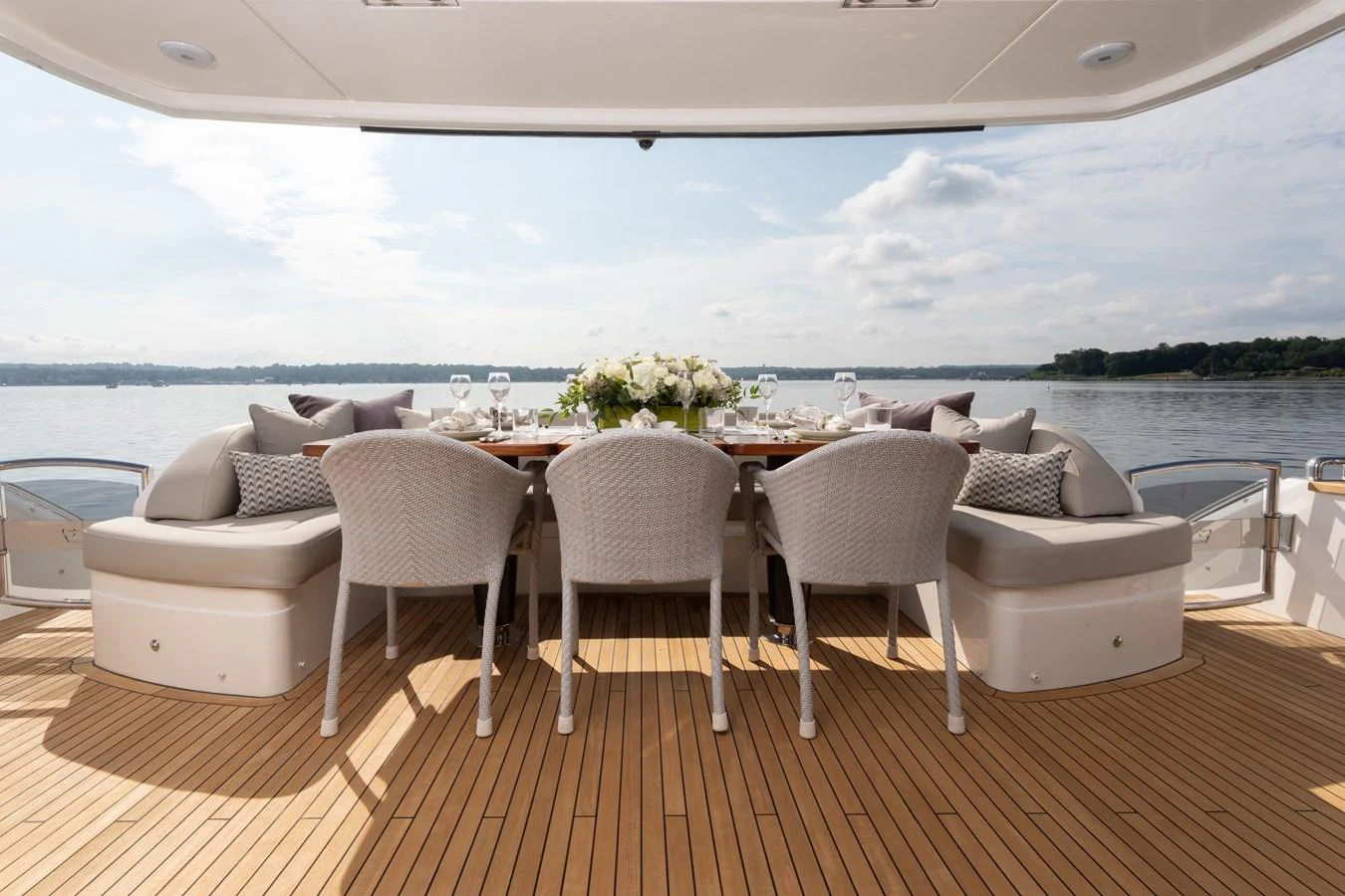 a table and chairs on a deck aboard JUST PERFECT Yacht for Sale