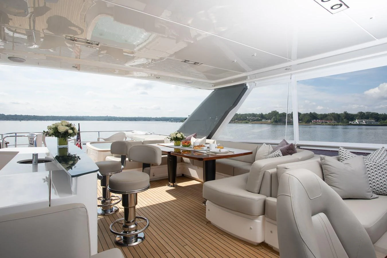 a room with a table chairs and a large window aboard JUST PERFECT Yacht for Sale