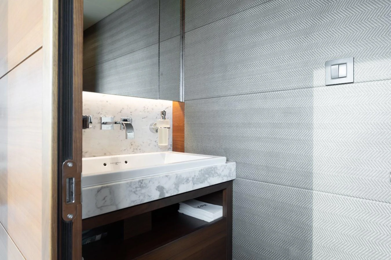 a bathroom with a sink and a mirror aboard JUST PERFECT Yacht for Sale