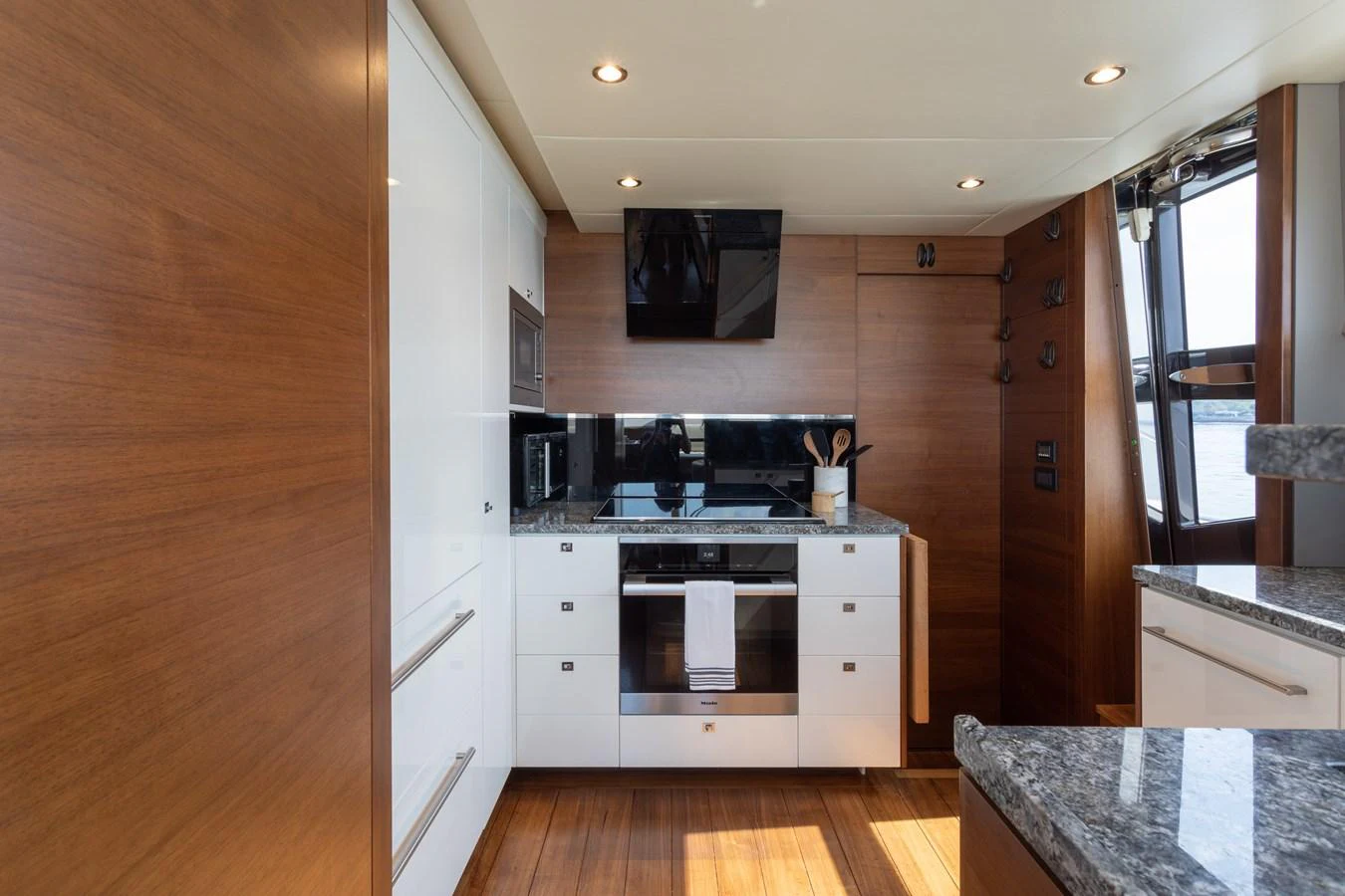 a kitchen with a wooden floor aboard JUST PERFECT Yacht for Sale