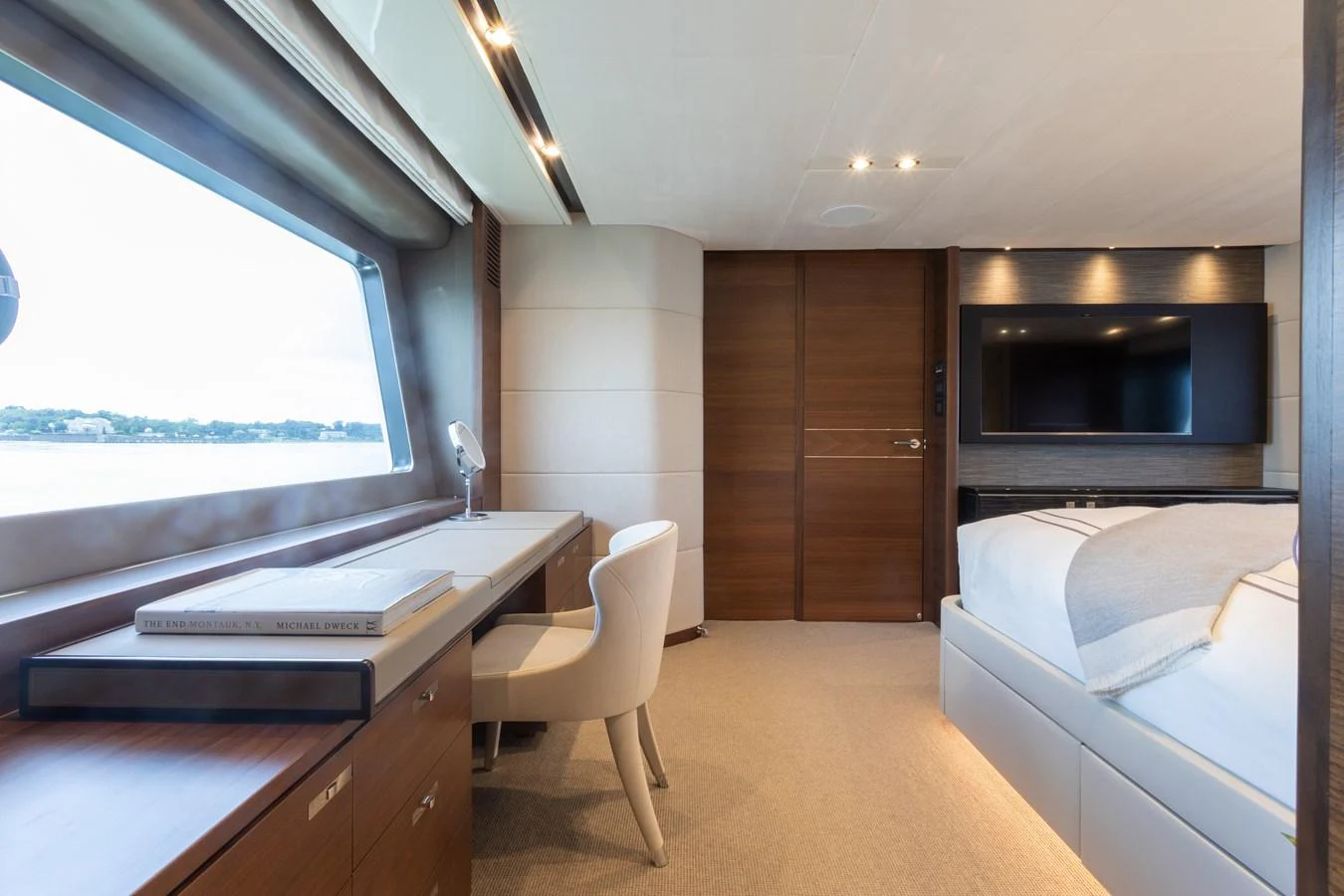 a room with a bed and a desk aboard JUST PERFECT Yacht for Sale