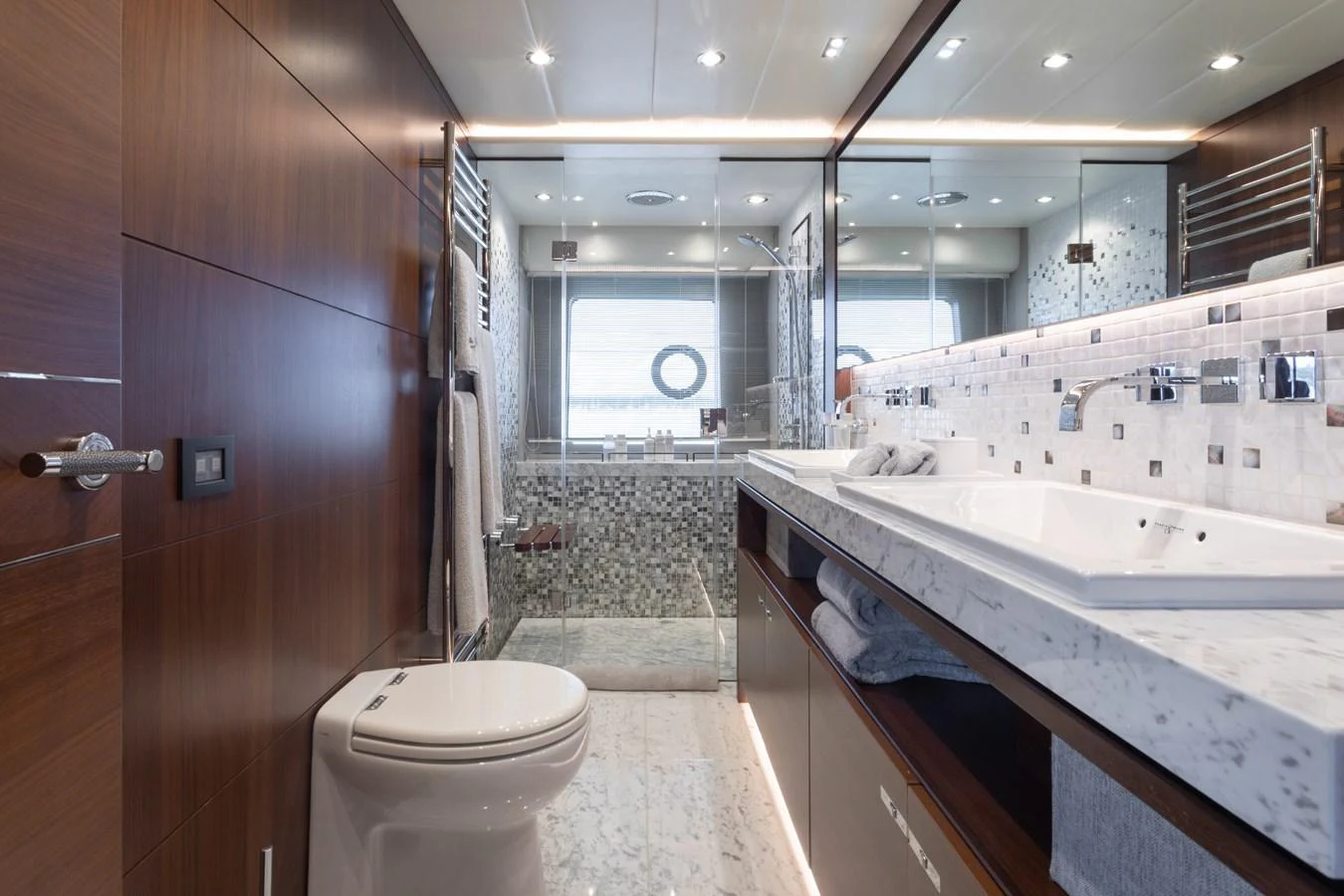 a bathroom with a tub sink and toilet aboard JUST PERFECT Yacht for Sale