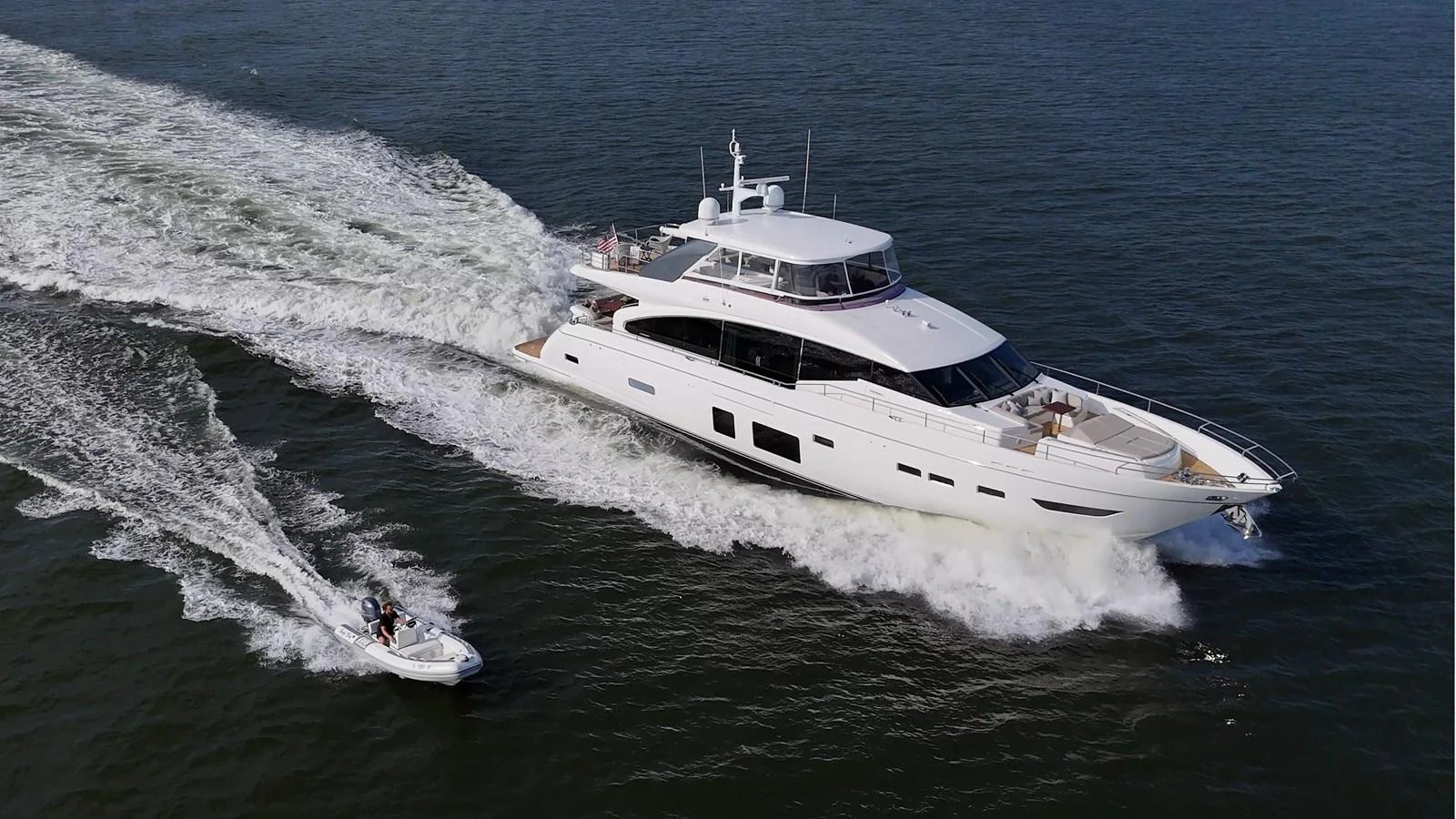 a white yacht on the water aboard JUST PERFECT Yacht for Sale