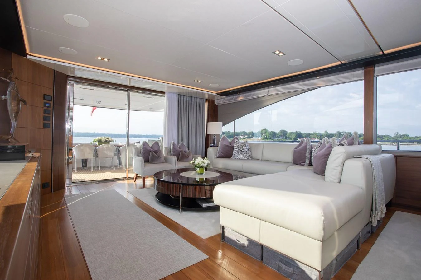 a living room with a large window aboard JUST PERFECT Yacht for Sale