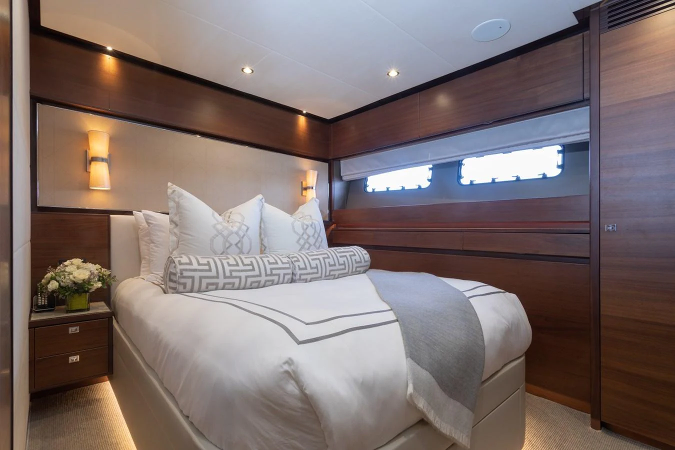 a bed with a white pillow aboard JUST PERFECT Yacht for Sale