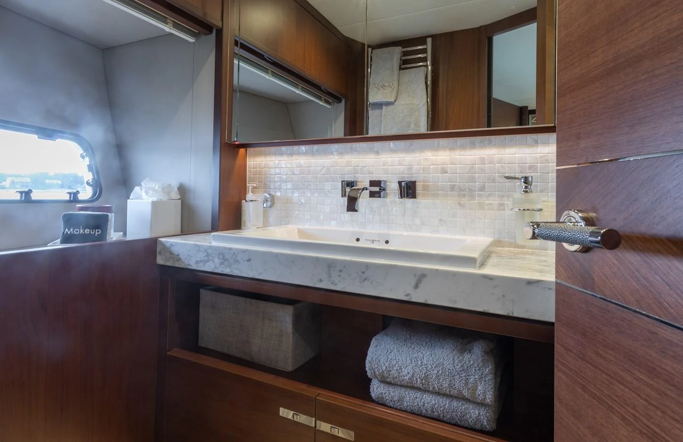 a bathroom with a sink and mirror aboard JUST PERFECT Yacht for Sale