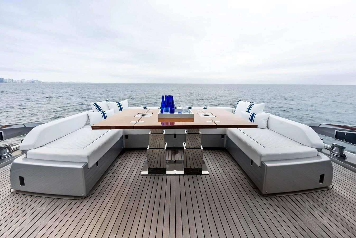 The aft deck features a spacious and elegant dining area with a stunning ocean view. aboard FERRETTI  TRADE Yacht for Sale