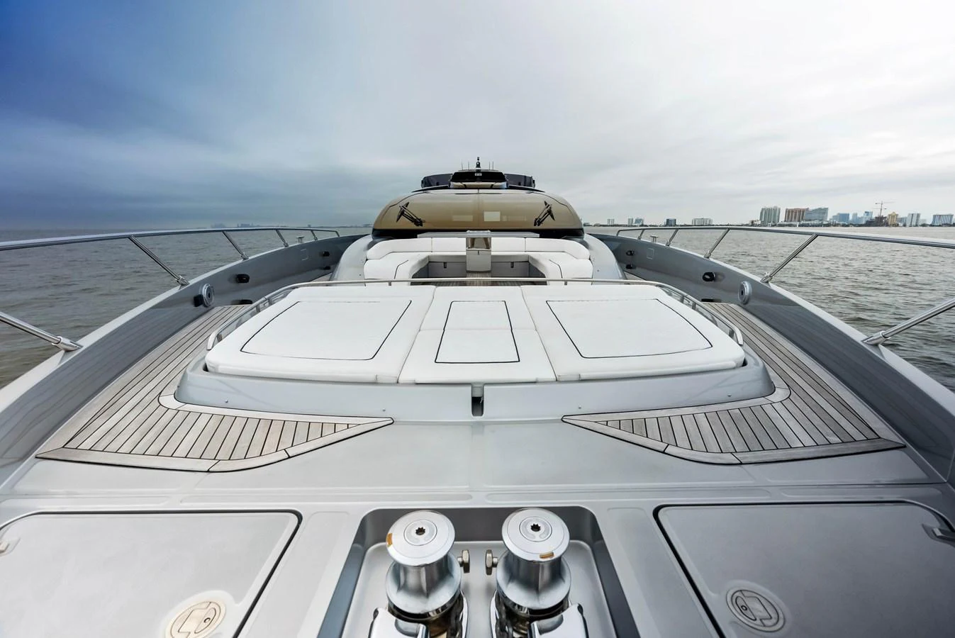 The foredeck of the yacht features spacious sun pads and sleek design elements. aboard FERRETTI  TRADE Yacht for Sale