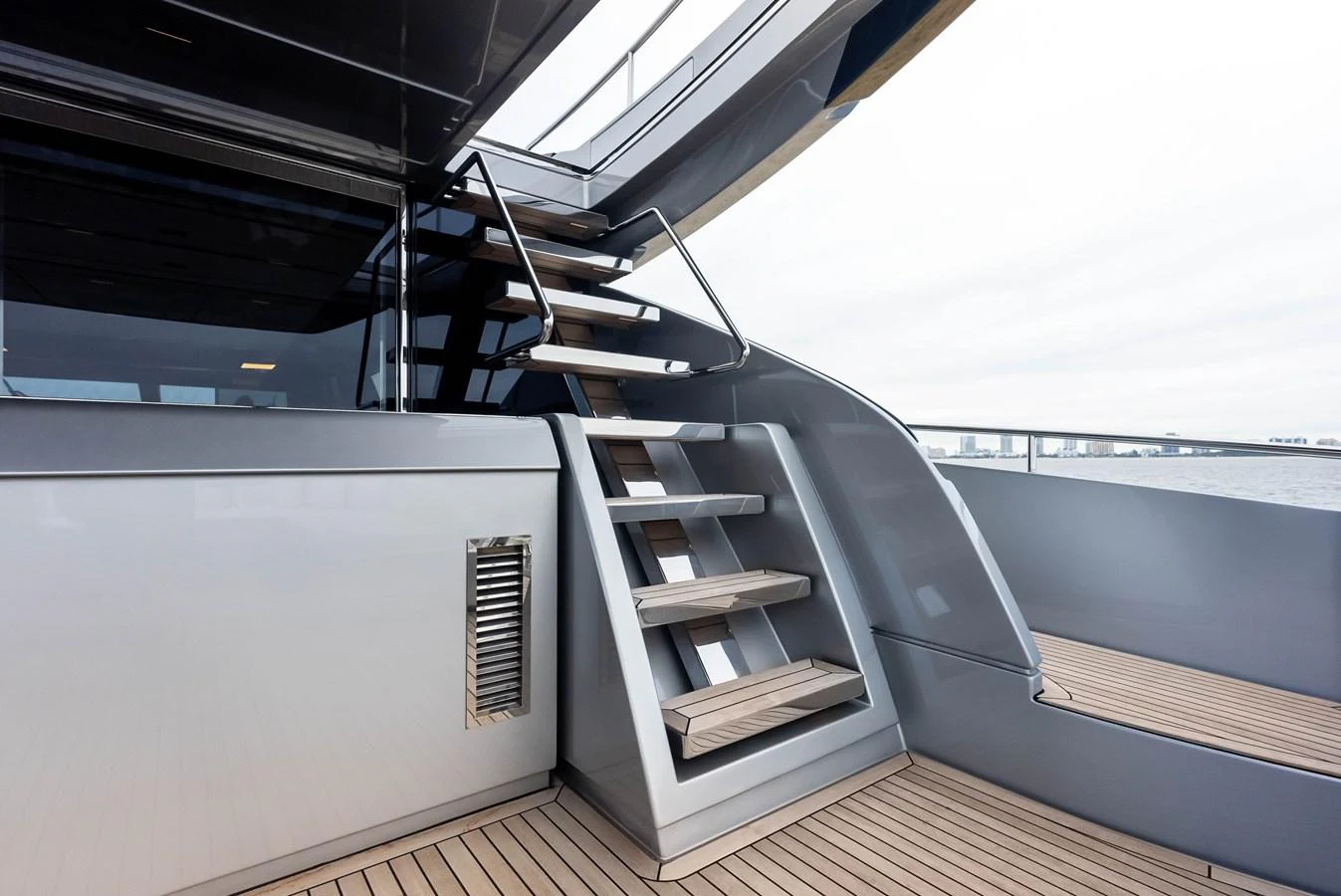 A sleek and modern staircase on the yacht's deck, leading to an upper level. aboard FERRETTI  TRADE Yacht for Sale