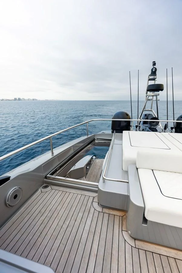 The aft deck features sleek design elements and comfortable seating with a view of the open sea. aboard FERRETTI  TRADE Yacht for Sale