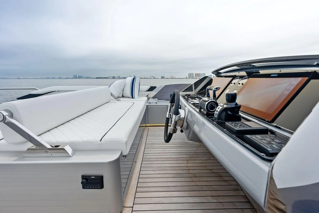The yacht's helm station offers a sleek and modern design with advanced navigation equipment and comfortable seating. aboard FERRETTI  TRADE Yacht for Sale