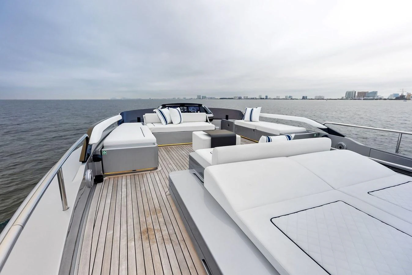 The yacht's sundeck offers ample lounging space with plush seating and panoramic views of the sea. aboard FERRETTI  TRADE Yacht for Sale