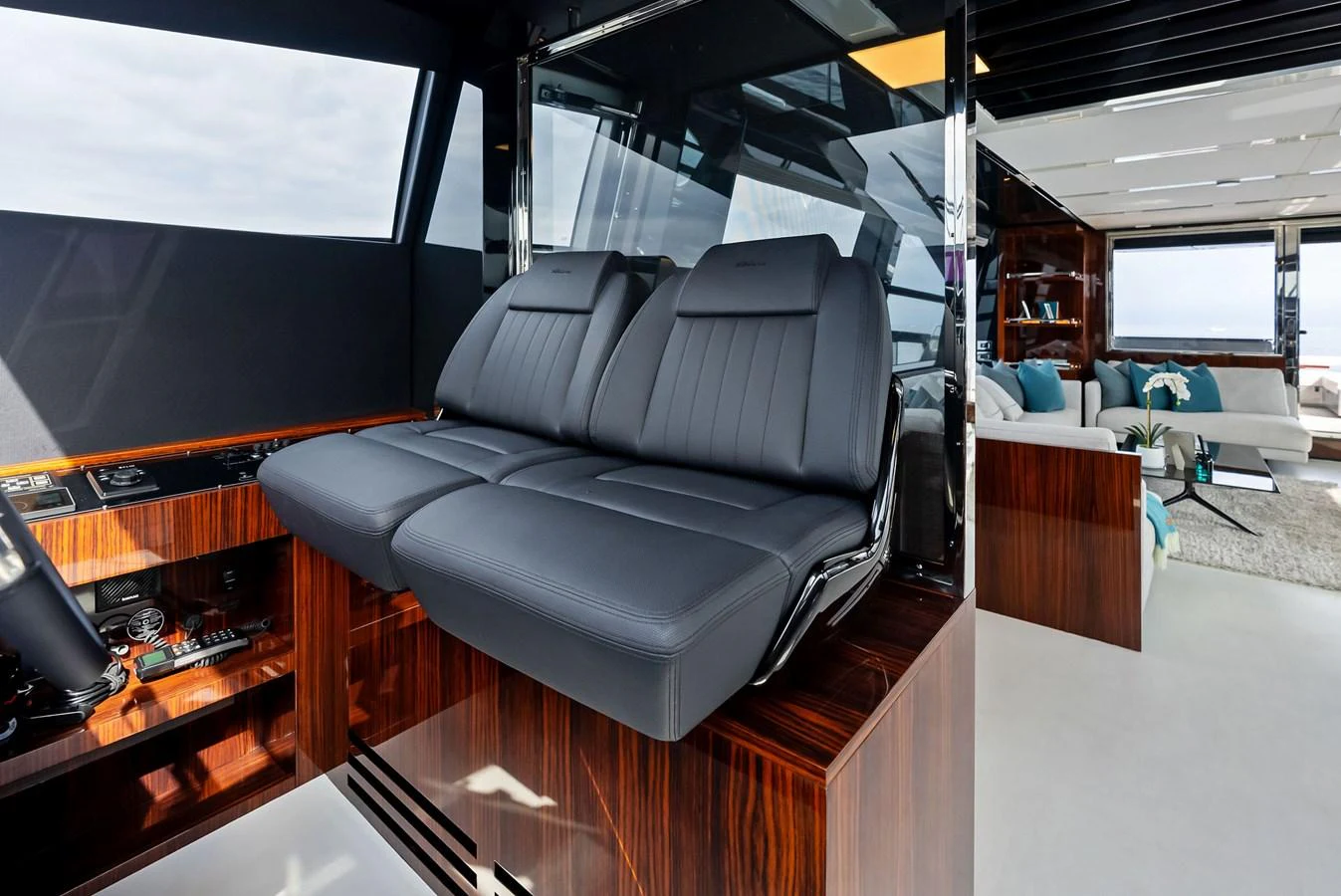 The helm area features sleek, modern seating with a view into the luxurious salon. aboard FERRETTI  TRADE Yacht for Sale