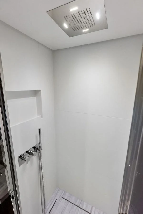 A modern and sleek shower area with minimalist design and high-end fixtures. aboard FERRETTI  TRADE Yacht for Sale