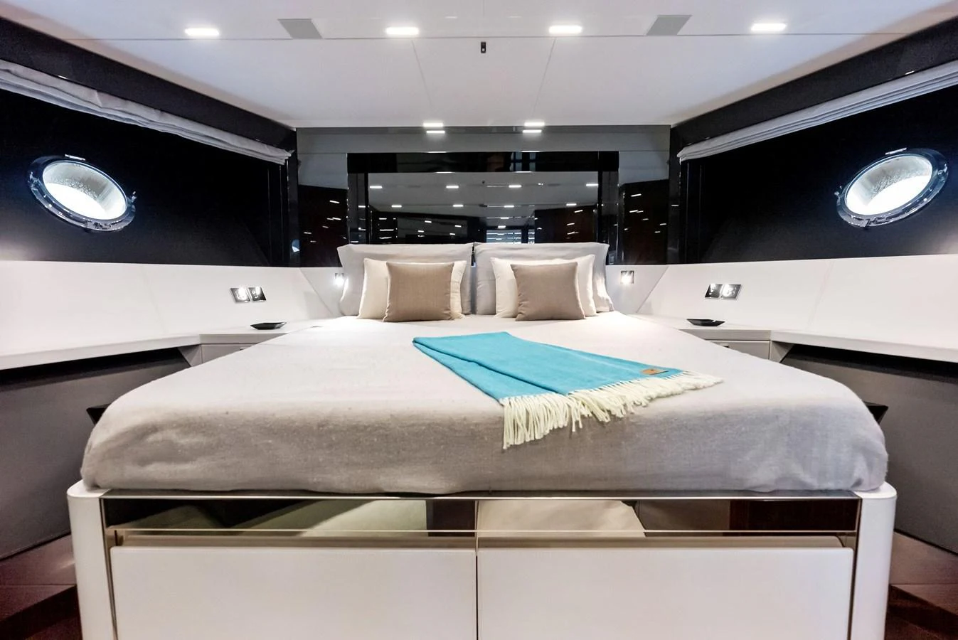 A luxurious stateroom featuring a plush bed with elegant bedding and modern lighting. aboard FERRETTI  TRADE Yacht for Sale