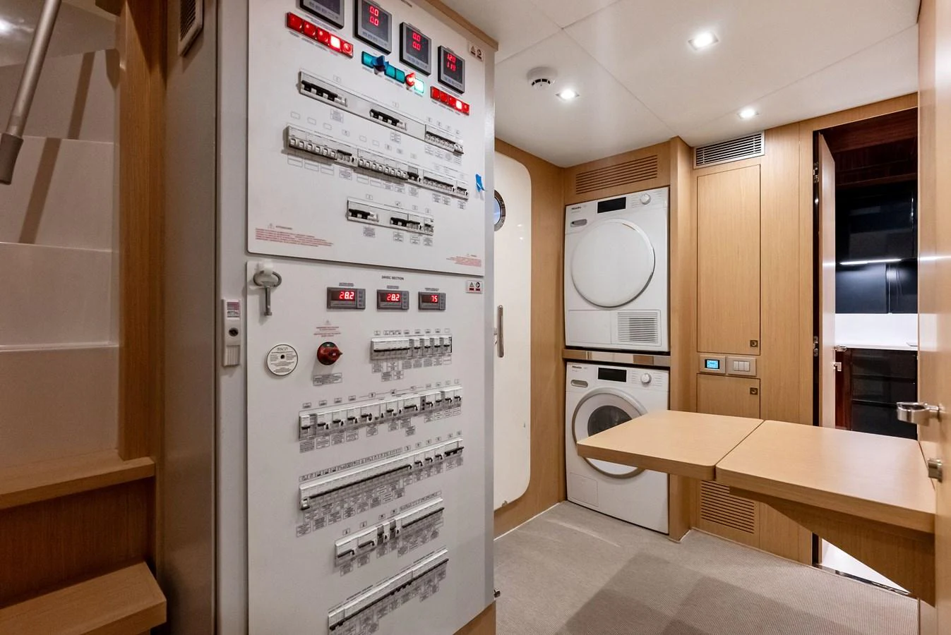 The yacht's laundry room is equipped with modern appliances and control panels. aboard FERRETTI  TRADE Yacht for Sale