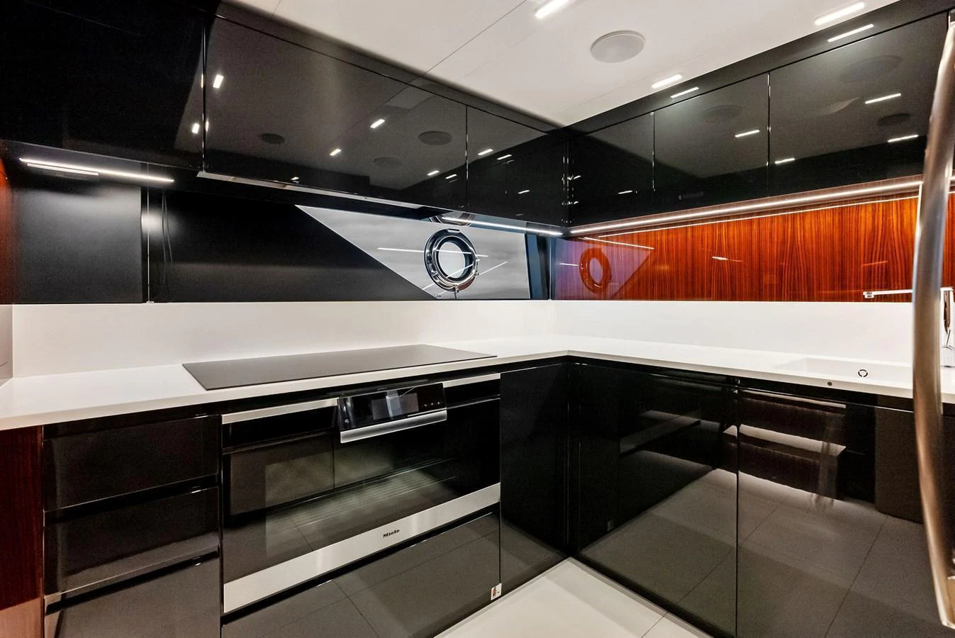 The sleek and modern galley features high-gloss cabinetry and state-of-the-art appliances. aboard FERRETTI  TRADE Yacht for Sale