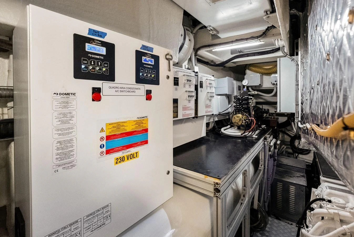 The image showcases the yacht's well-organized engine room with essential control panels and equipment. aboard FERRETTI  TRADE Yacht for Sale