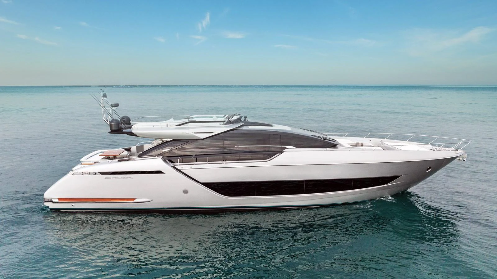 A sleek and modern yacht glides gracefully on calm waters under a clear sky. aboard FERRETTI  TRADE Yacht for Sale
