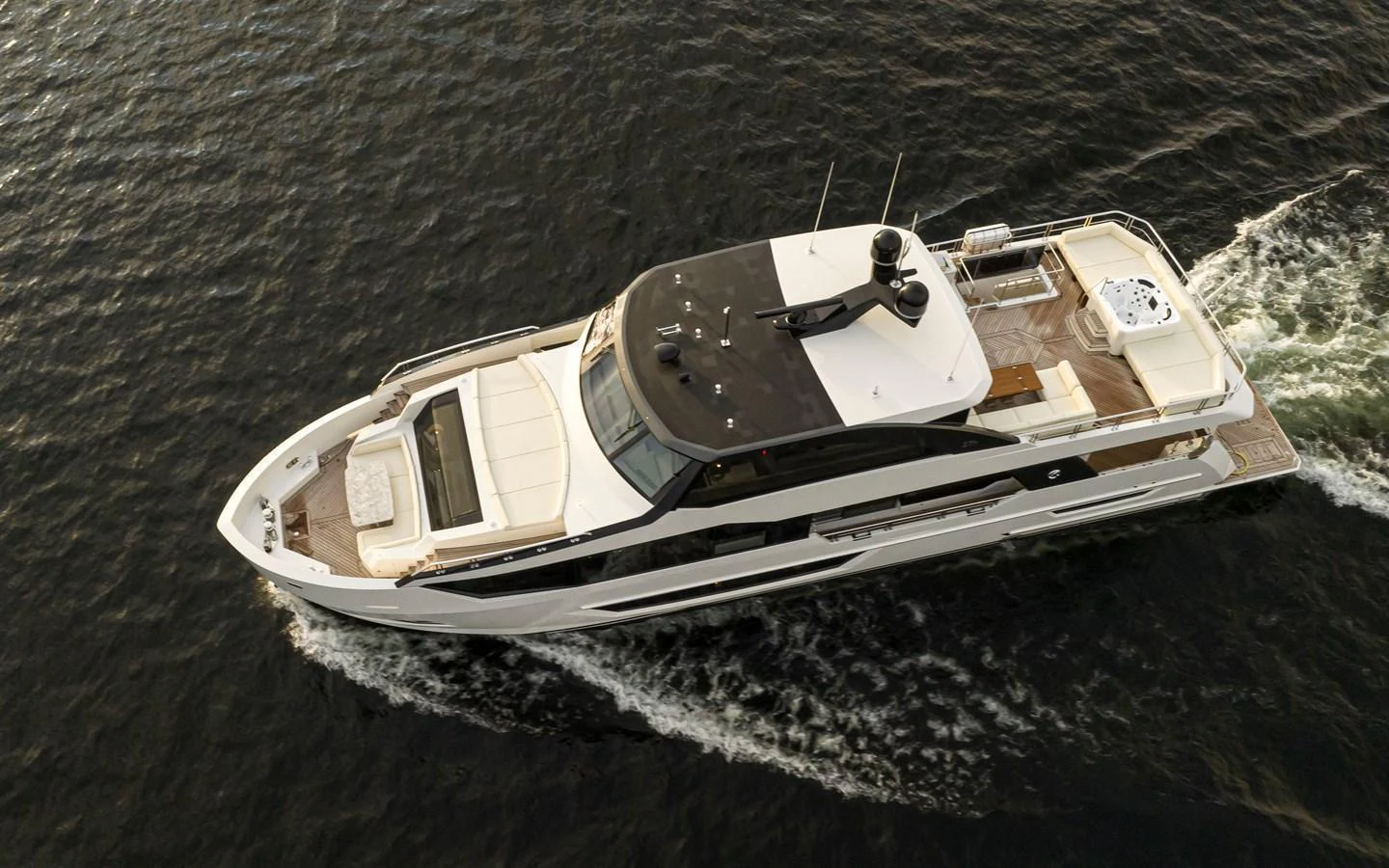 A sleek and modern yacht cruises gracefully through the water, showcasing its elegant design and spacious deck areas. aboard STILL WATERS Yacht for Sale