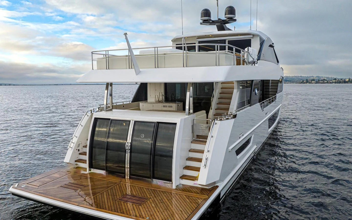 The yacht's aft deck showcases a spacious and elegant design with ample seating and a sleek finish. aboard STILL WATERS Yacht for Sale