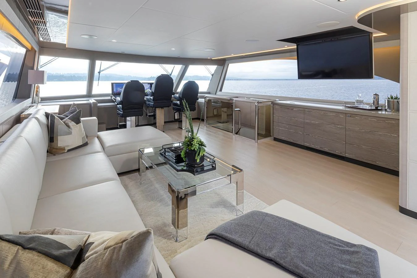 The salon offers a spacious and modern living area with panoramic views and luxurious furnishings. aboard STILL WATERS Yacht for Sale