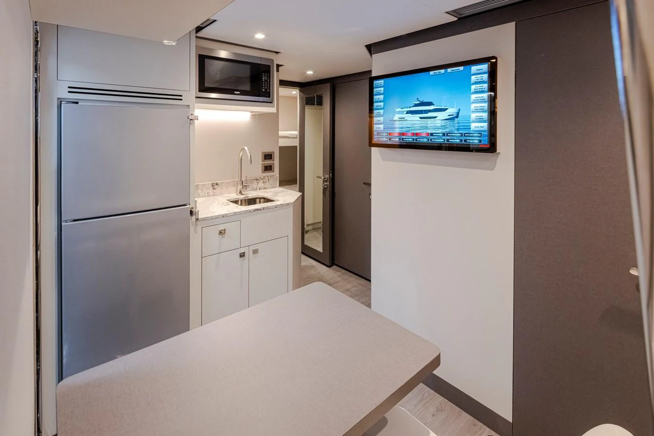 The yacht's galley features modern appliances and a cozy dining area. aboard STILL WATERS Yacht for Sale