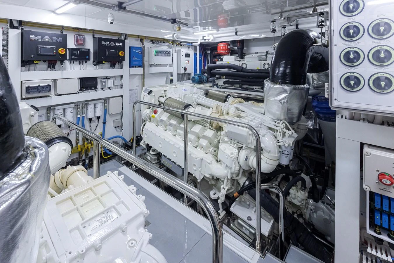 The image showcases a well-maintained engine room with advanced machinery and equipment. aboard STILL WATERS Yacht for Sale