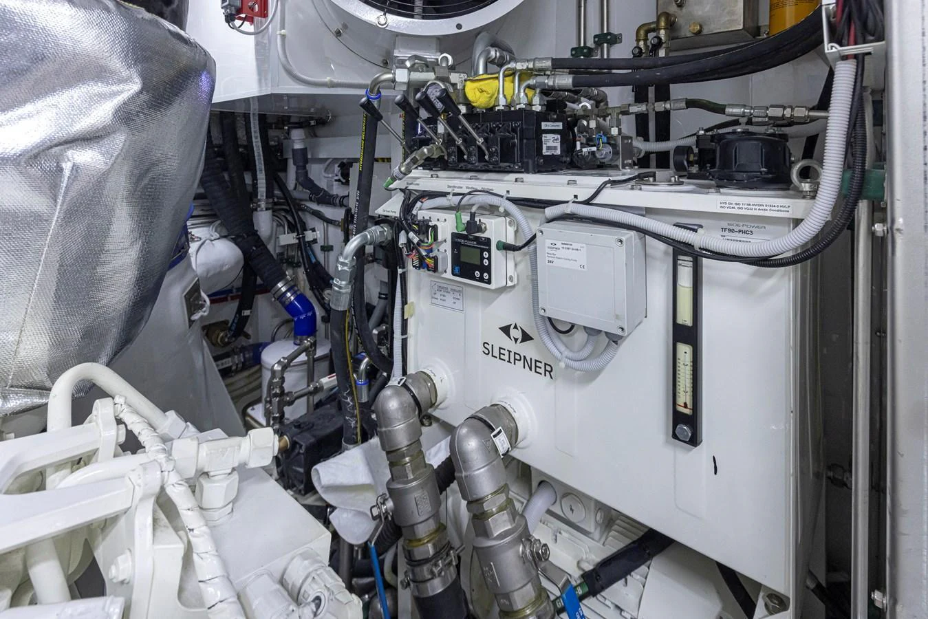 The image showcases the intricate machinery and equipment within the yacht's engine room. aboard STILL WATERS Yacht for Sale