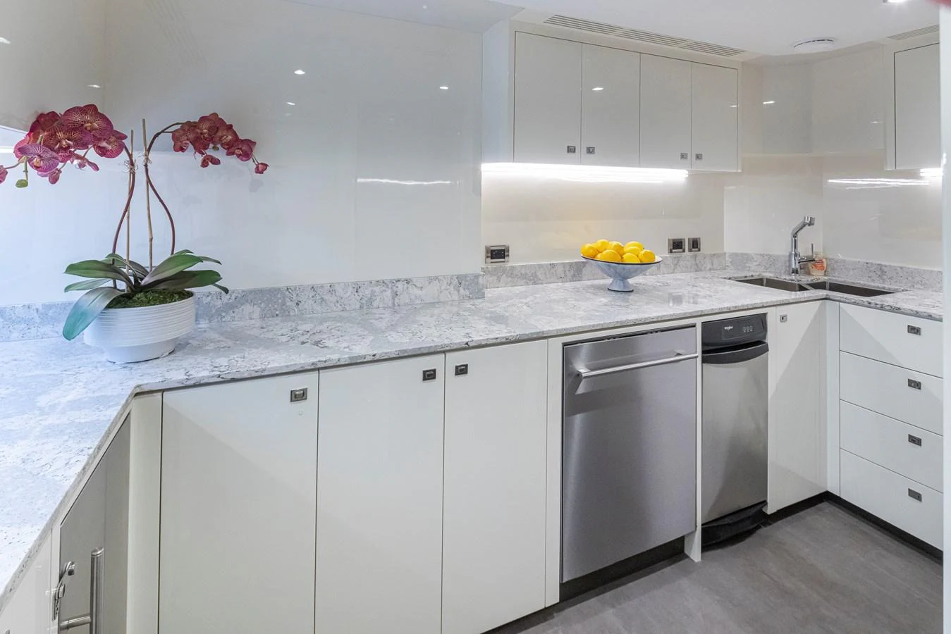 The yacht's galley features modern appliances and sleek countertops, creating a stylish and functional space. aboard STILL WATERS Yacht for Sale