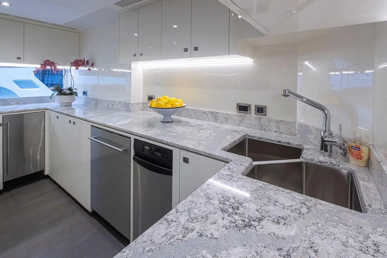 The yacht's galley features modern appliances and a sleek, spacious countertop. aboard STILL WATERS Yacht for Sale