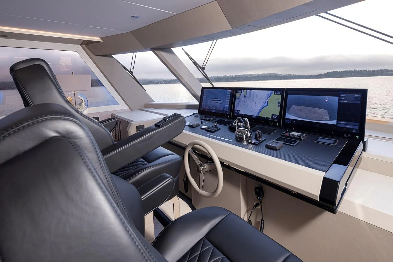 The helm station features state-of-the-art navigation equipment and luxurious seating with panoramic views. aboard STILL WATERS Yacht for Sale