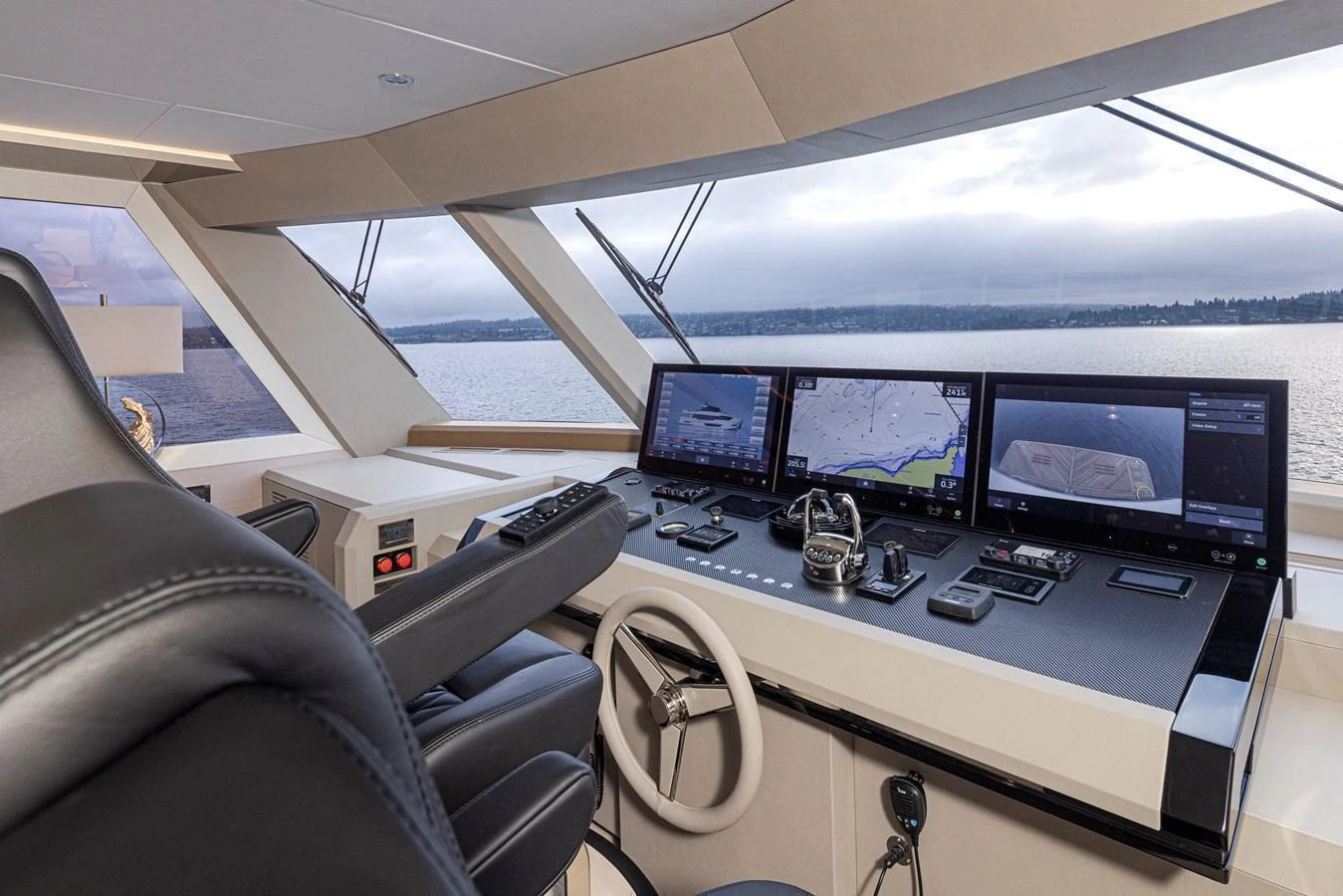 The helm station offers advanced navigation technology and a panoramic view of the sea. aboard STILL WATERS Yacht for Sale