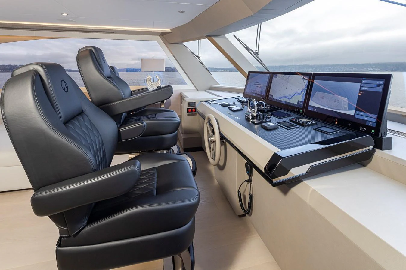The helm station features luxurious leather seating and state-of-the-art navigation equipment. aboard STILL WATERS Yacht for Sale