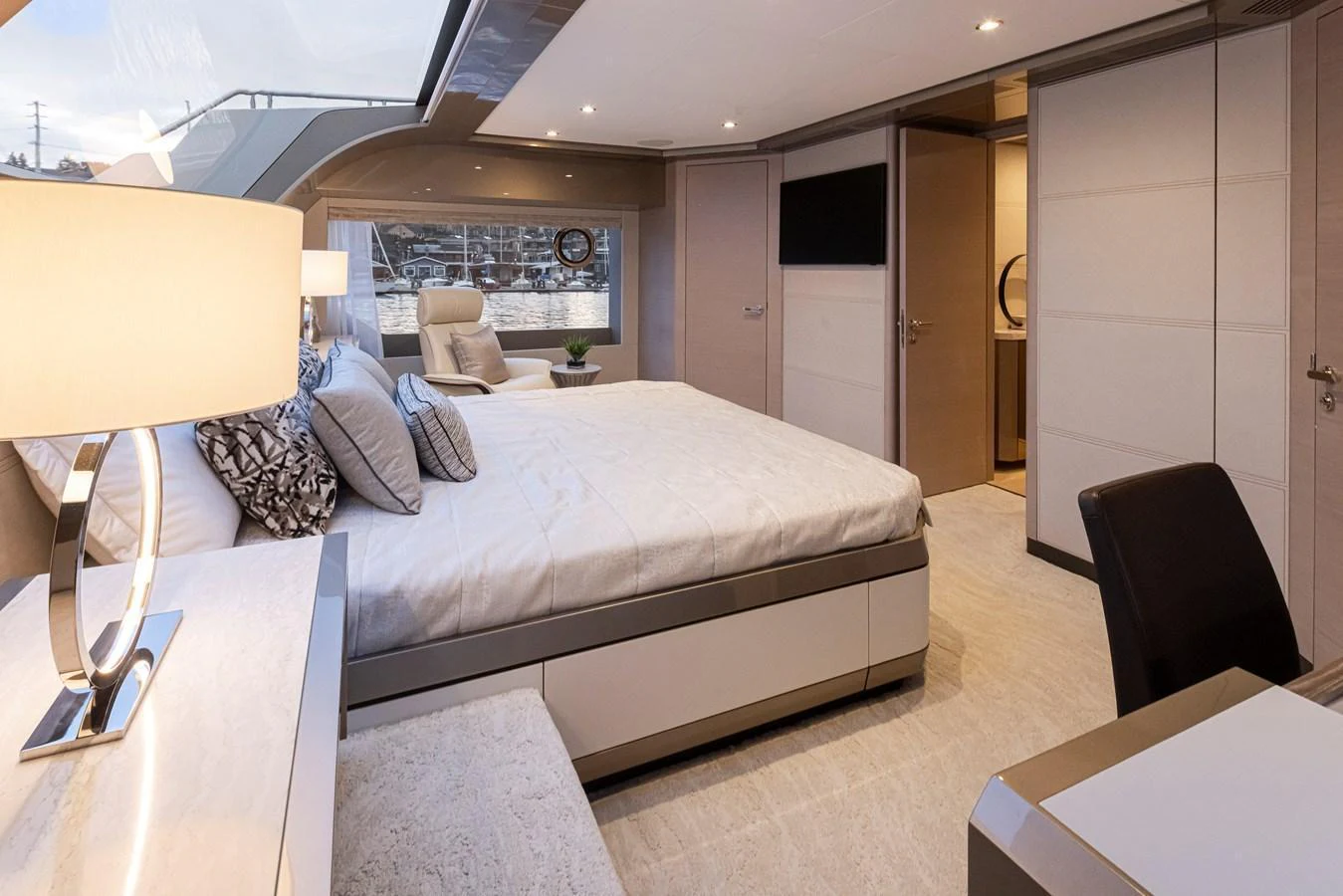 The stateroom features a spacious bed, modern furnishings, and ample natural light. aboard STILL WATERS Yacht for Sale