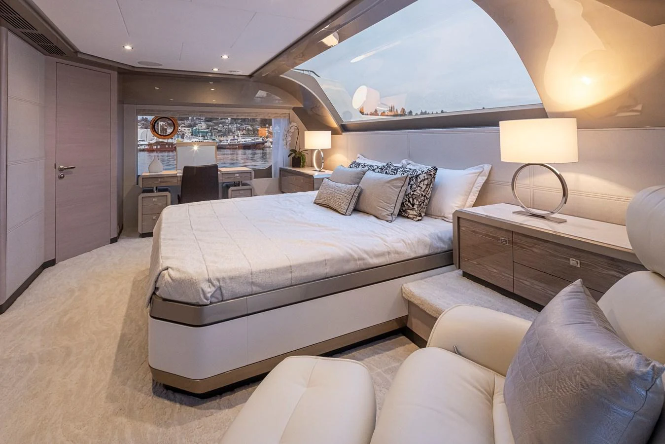 The master stateroom features a luxurious bed with ample natural light and elegant furnishings. aboard STILL WATERS Yacht for Sale