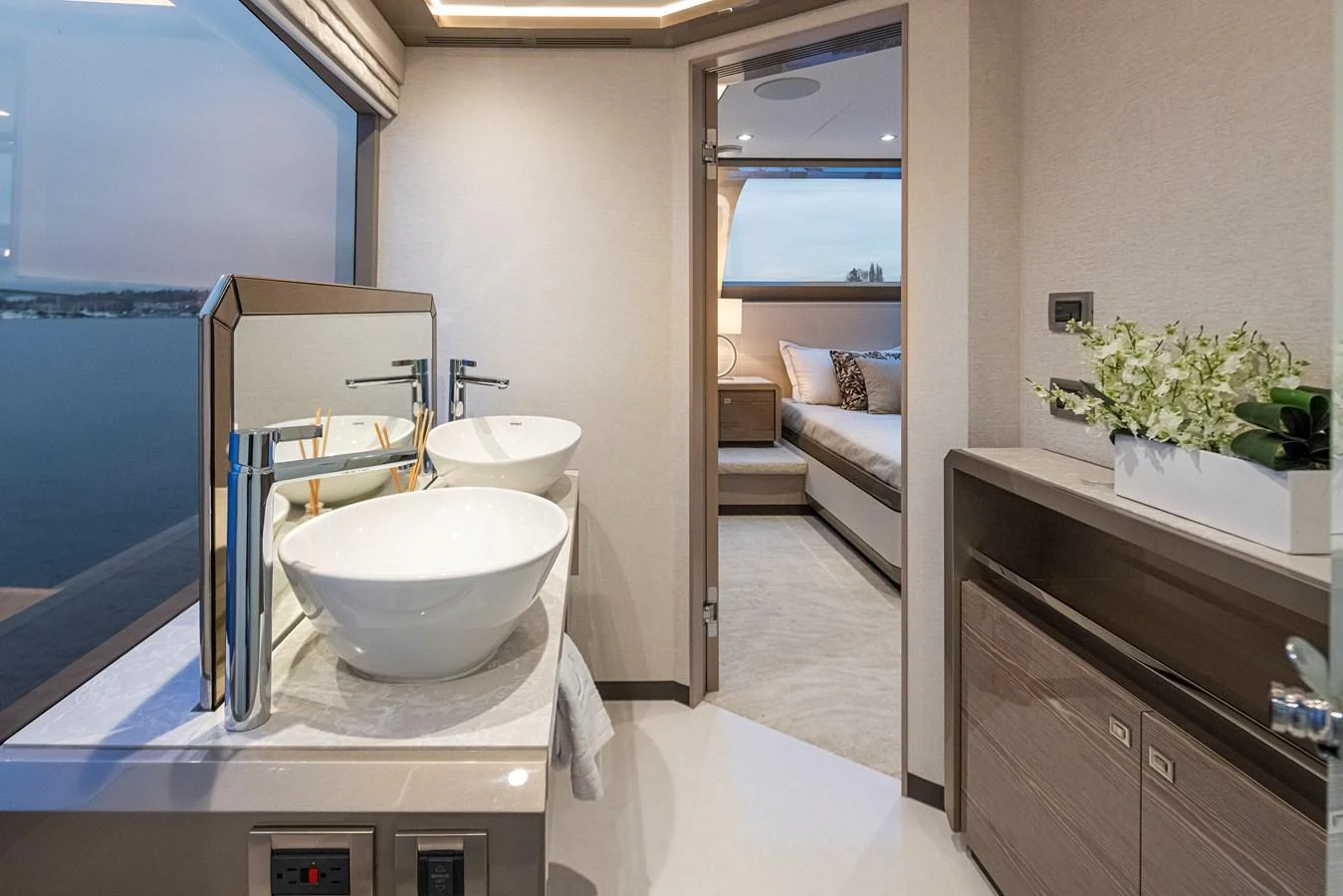 The yacht's bathroom features modern fixtures and a serene view through the window. aboard STILL WATERS Yacht for Sale