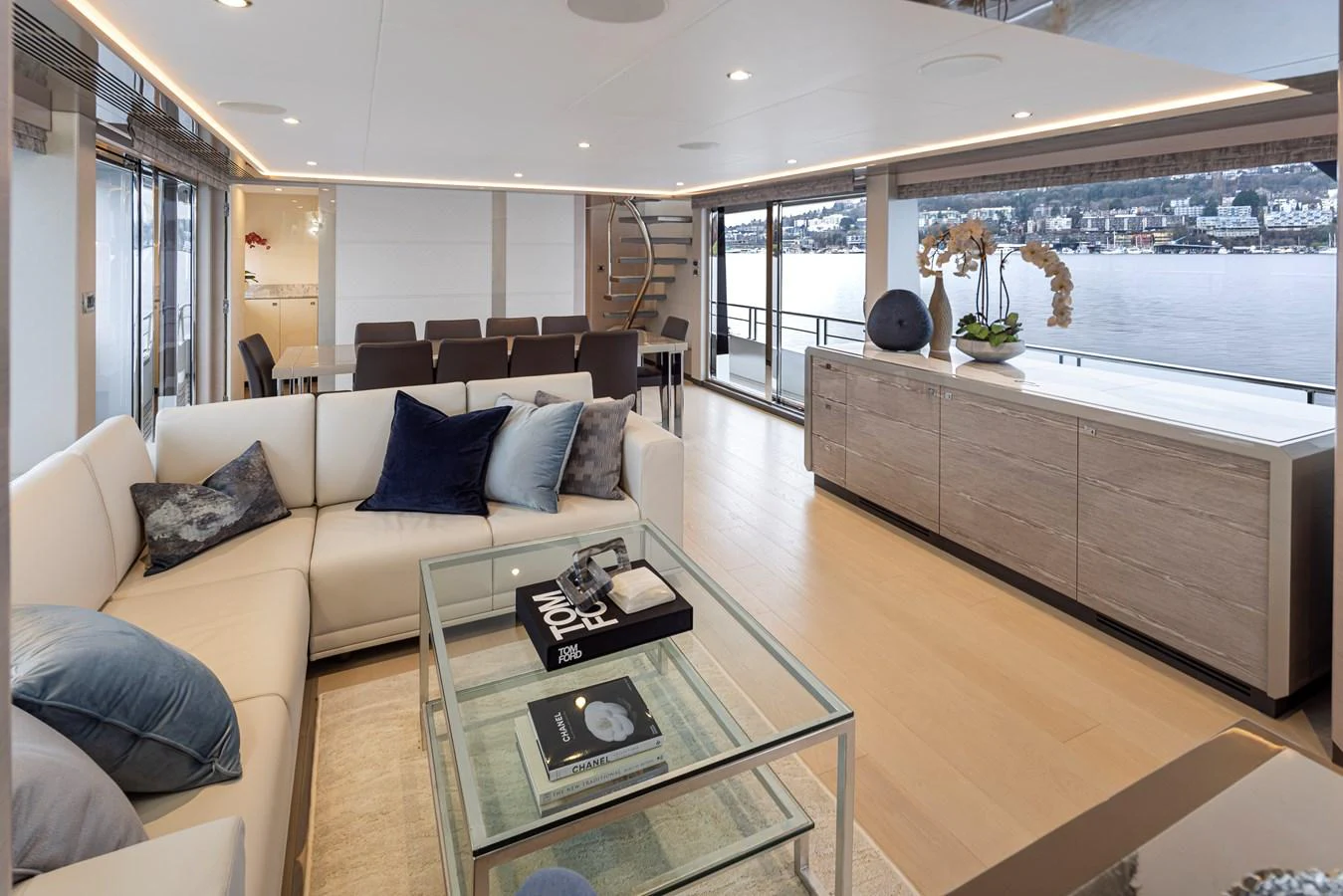 The salon features a spacious and elegant seating area with large windows offering stunning views. aboard STILL WATERS Yacht for Sale