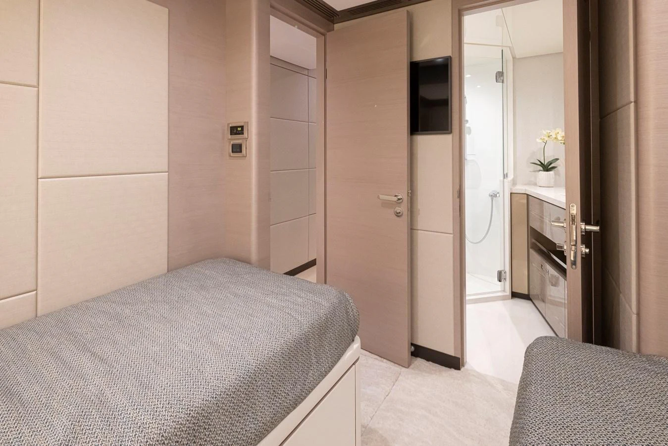 The guest cabin features twin beds and an ensuite bathroom, offering a cozy and private retreat. aboard STILL WATERS Yacht for Sale