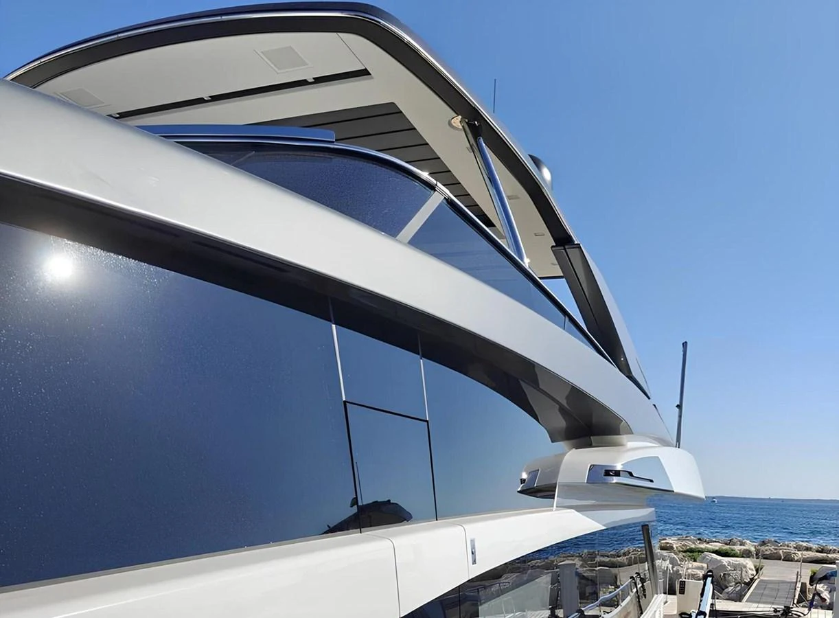 A sleek and modern yacht exterior with clean lines and a stylish design. aboard NADINKA Yacht for Sale