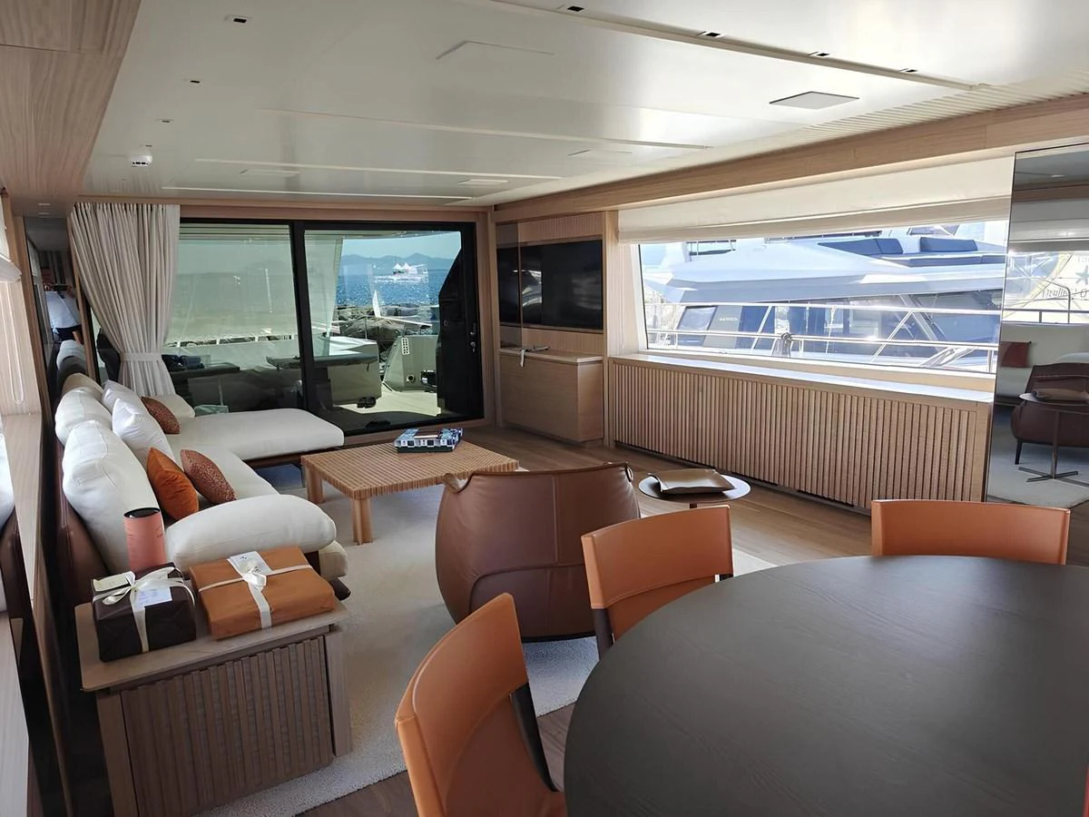 The yacht's salon features a spacious and modern design with ample seating and large windows for natural light. aboard NADINKA Yacht for Sale