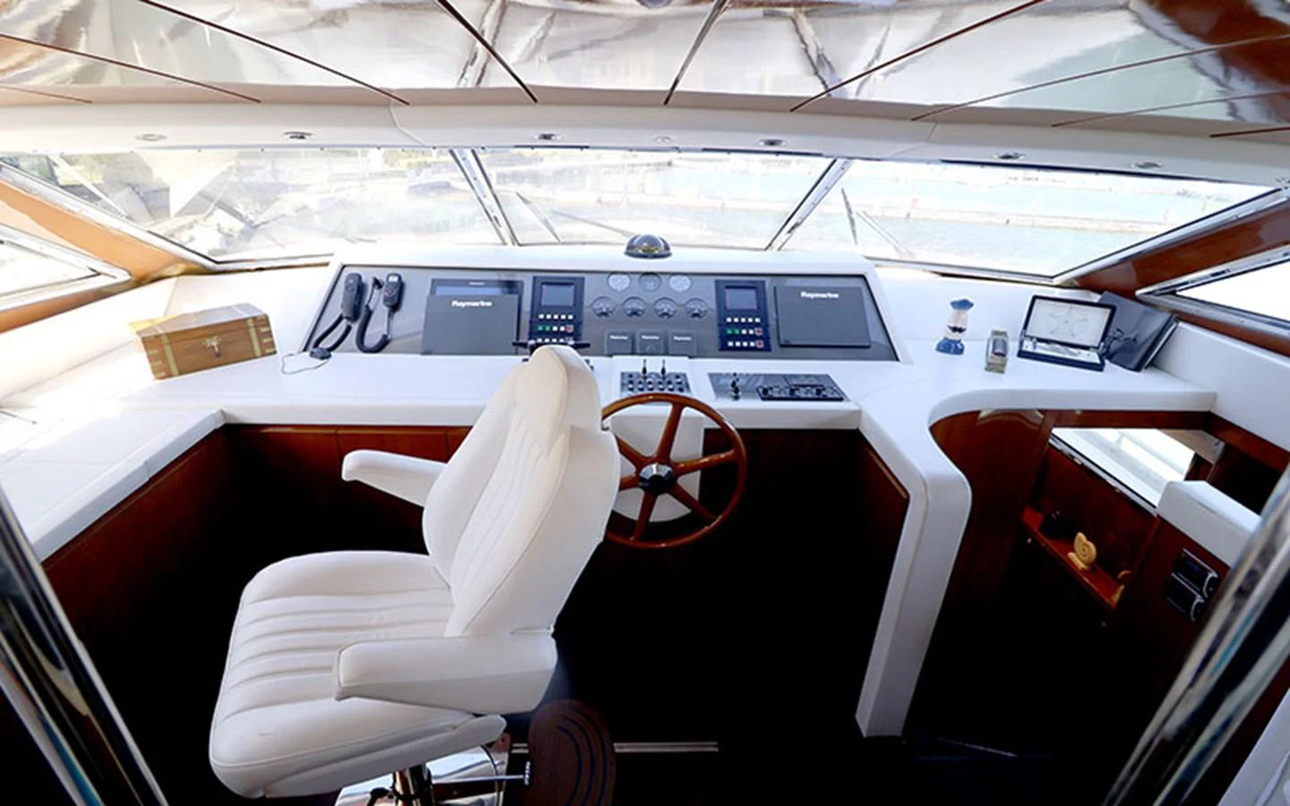 The helm station features a sleek design with advanced navigation equipment and a comfortable captain's chair. aboard MEP TOGETHER Yacht for Sale