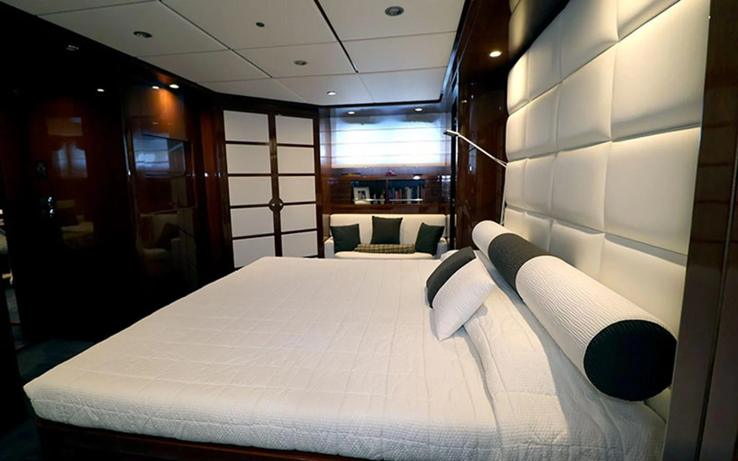 The master stateroom features a luxurious bed with elegant decor and ample natural light. aboard MEP TOGETHER Yacht for Sale