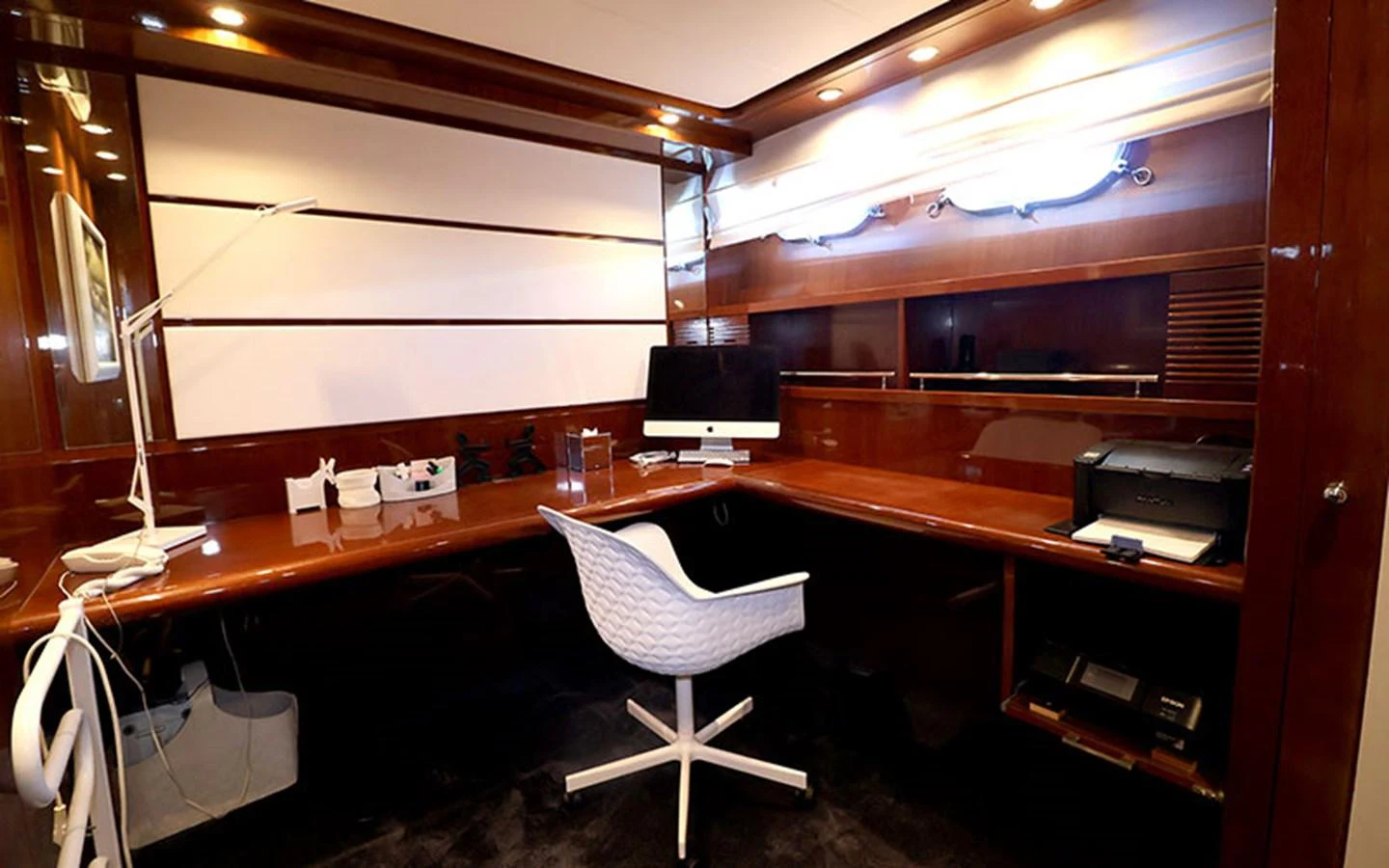 The yacht's office features a sleek, modern design with a large desk and comfortable seating. aboard MEP TOGETHER Yacht for Sale